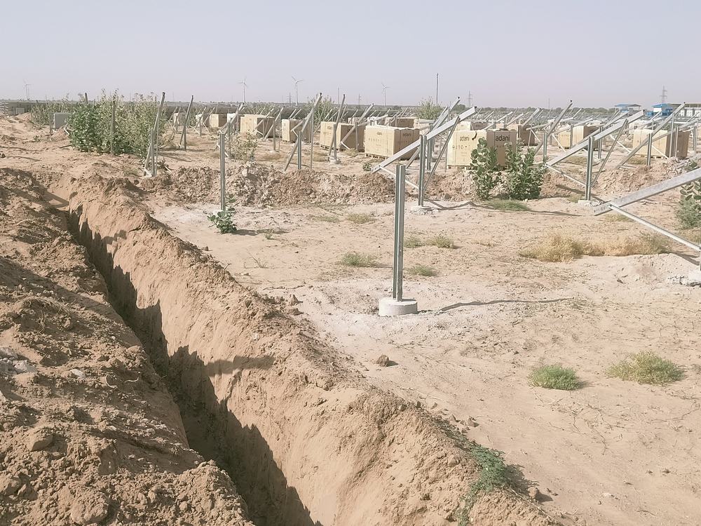 Module mounting structures and cable trench at the 240 MW NTPC solar project in Devikot, Jaisalmer